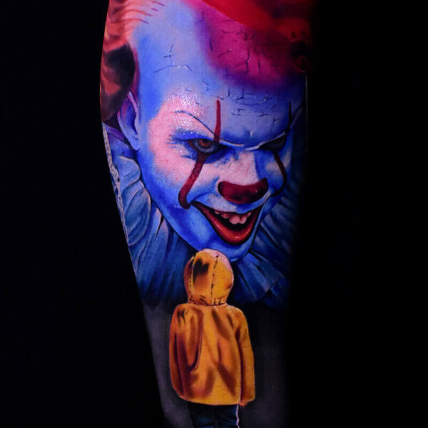 Atticus Tattoo| Colour realism tattoo of Pennywise and George from "IT"