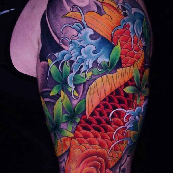 Atticus Tattoo| Japanese Neotraditional tattoo of an orange koi fish with leaves and waves
