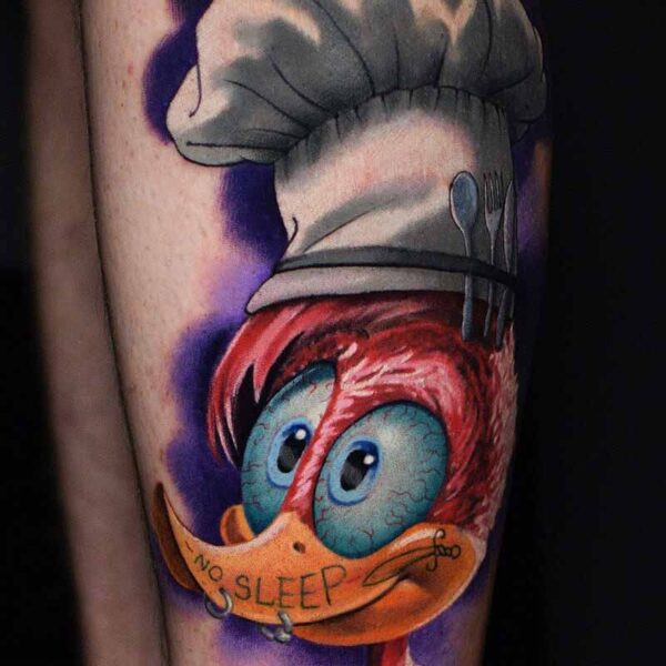 Atticus Tattoo| Cartoon tattoo of Woody Wood Pecker wearing a chefs hat