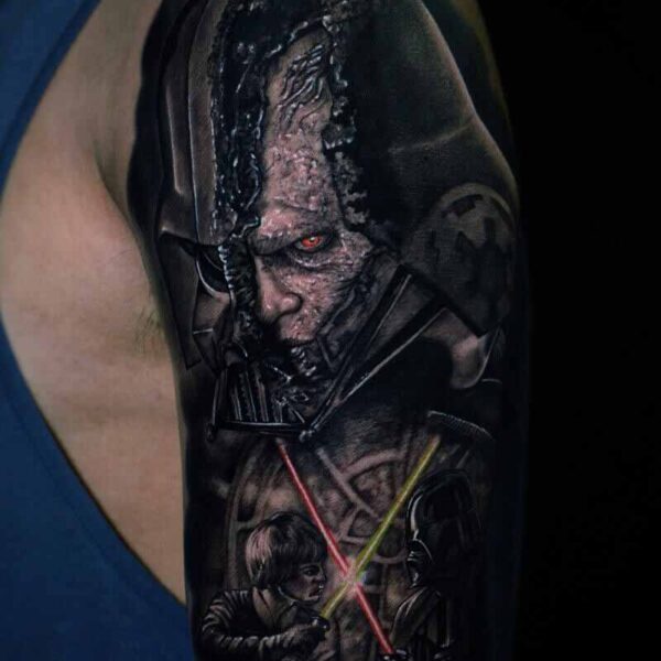 Atticus Tattoo| Realism tattoo of Darth Vader with his helmet spilt open, with the scene of him and Luke Skywalker fighting in front