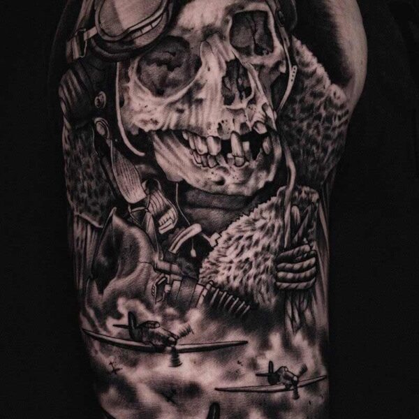 Atticus Tattoo| Black and grey realism tattoo of a skeleton pilot and fighter planes