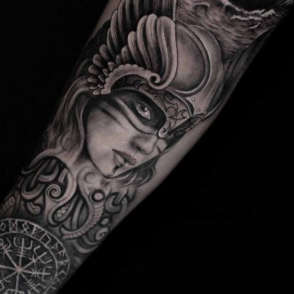 Atticus Tattoo| Black and grey realism tattoo of a viking woman with a ship
