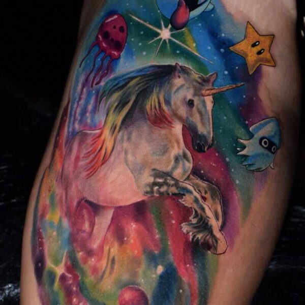 Atticus Tattoo| Colour realism tattoo of a unicorn, Mario Kart items and rainbow background