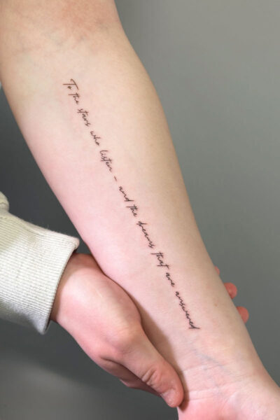 Script tattoo by Yeva at Atticus Tattoo, Calgary