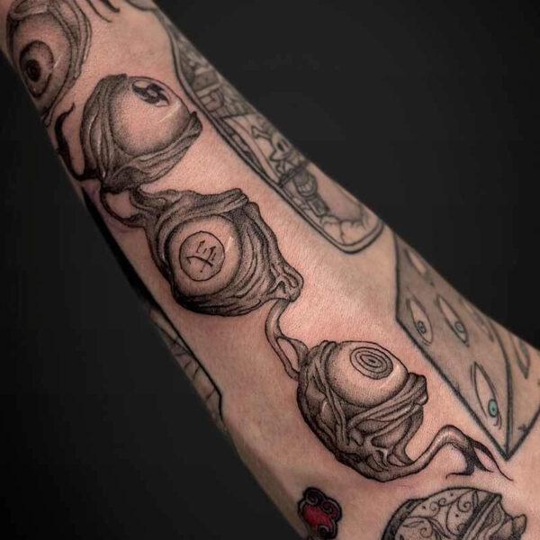 Atticus Tattoo| Illustrative, anime tattoo of eyeballs of different anime characters