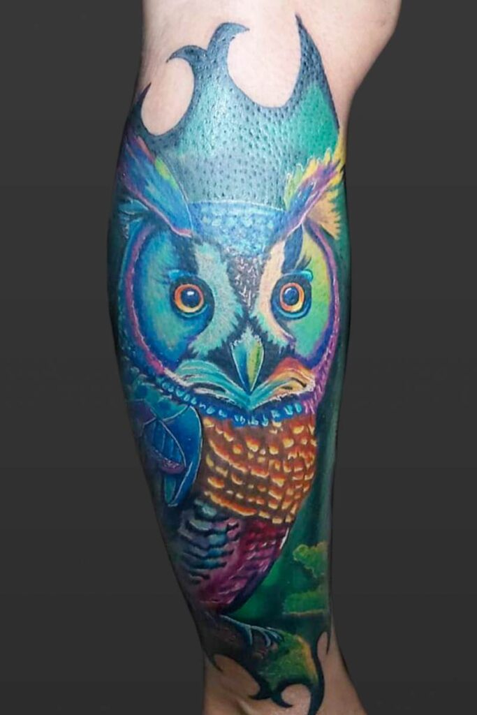Atticus Tattoo| Realism tattoo of an owl with bright neon colours