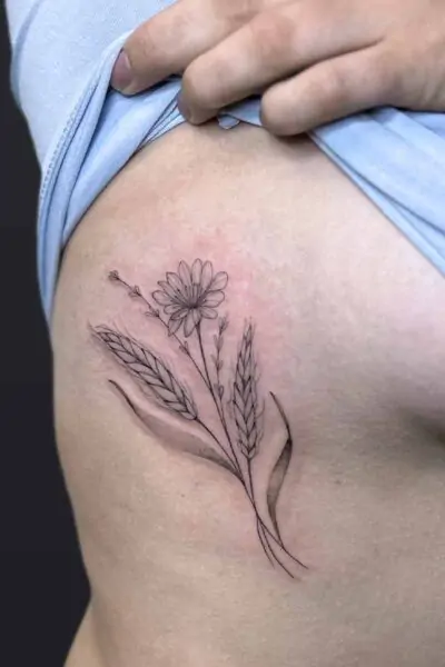 Atticus Tattoo| Fineline tattoo of a flower with wheat