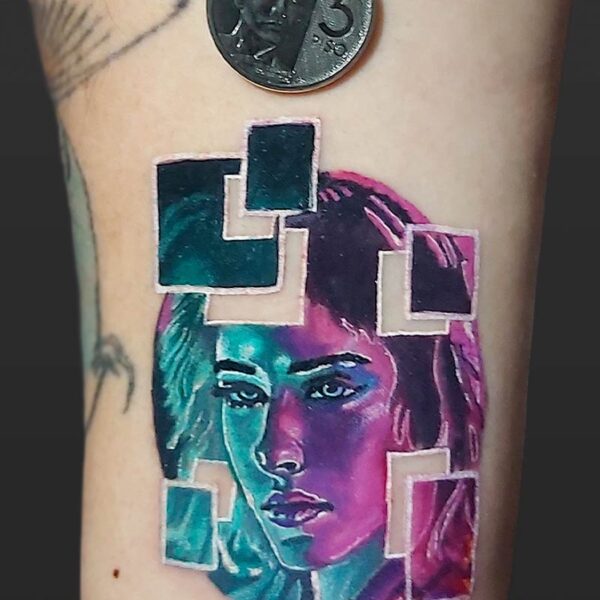 Atticus Tattoo| Neon tattoo of a portrait of a blue and purple woman