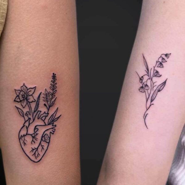 Black and Grey Tattoos- Heart and Flowers Atticus Tattoo| Walk-in tattoo| Black and grey tattoos of flowers and a heart with flowers growing out of it