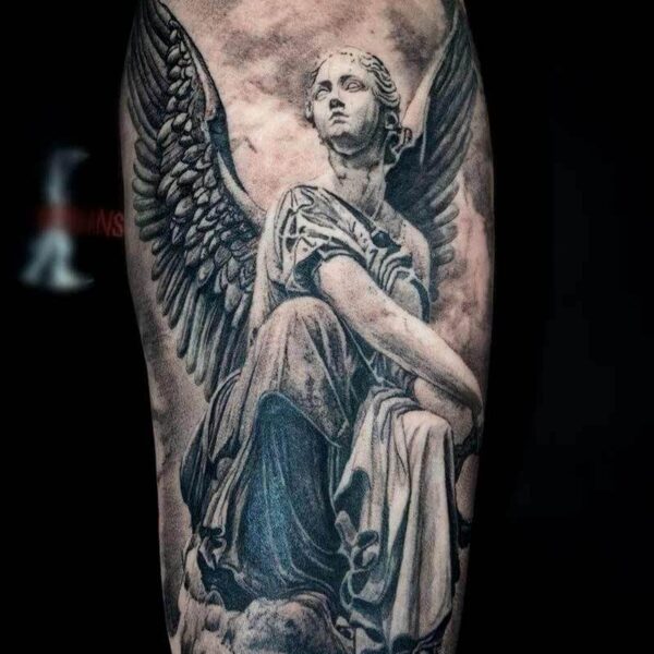 Black and Grey Realism Tattoo- Angel Statue Atticus Tattoo| Black and grey realism tattoo of a statue of an angel