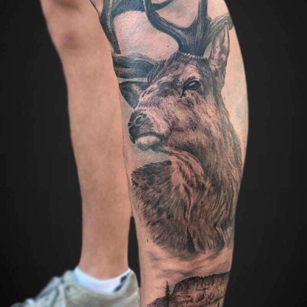 Black and Grey Realism Tattoo- Elk and Mountains Atticus Tattoo| Black and grey realism tattoo of an elk