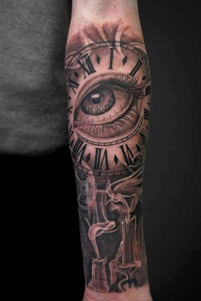 Atticus Tattoo| Black and grey realism tattoo of an eye, clock and candle