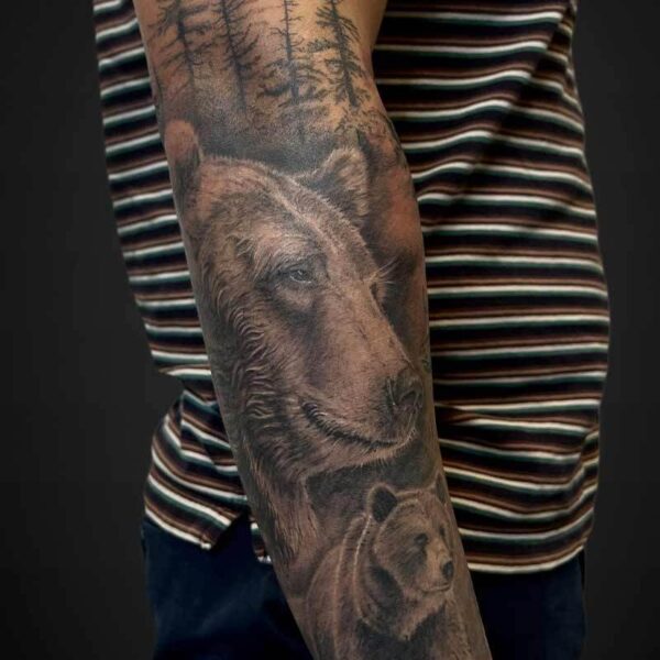Black and Grey Realism Tattoo- Grizzly and Forest Atticus Tattoo| Grizzly Bear in a forest