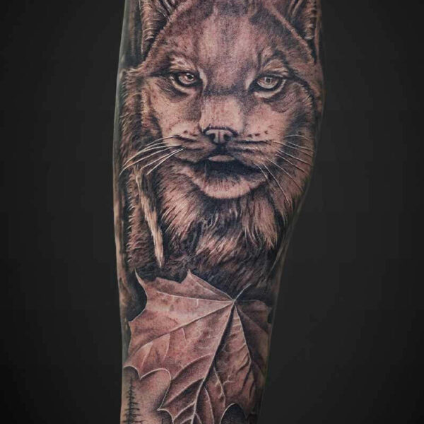 Black and Grey Realism Tattoo- Lynx Atticus Tattoo| Black and grey realism tattoo of a lynx and maple leaf