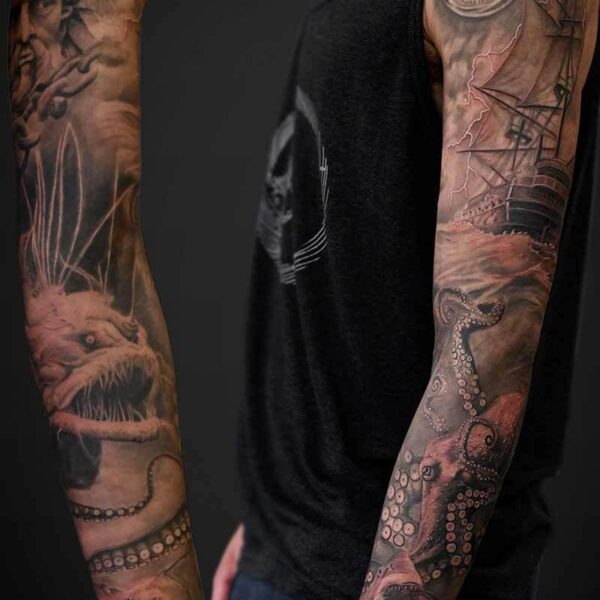 Black and Grey Realism Tattoo- Nautical Sleeve Atticus Tattoo| Black and grey realism tattoo of ocean life, a sailing ship and Poseidon