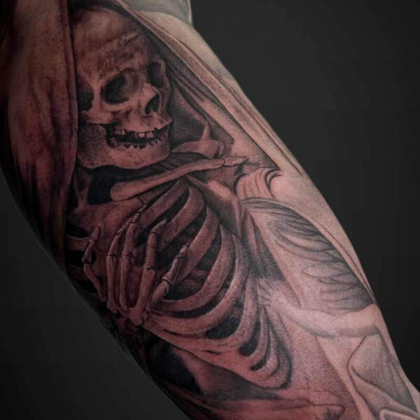 Black and Grey Realism Tattoo- Skeleton Atticus Tattoo| Black and grey realism tattoo of a skeleton in a cloak