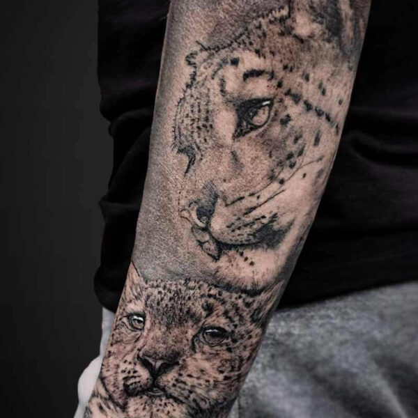 Black and Grey Realism Tattoo- Snow Leopard Family Atticus Tattoo| Black and grey realism tattoo of a mother snow leopard and her cub