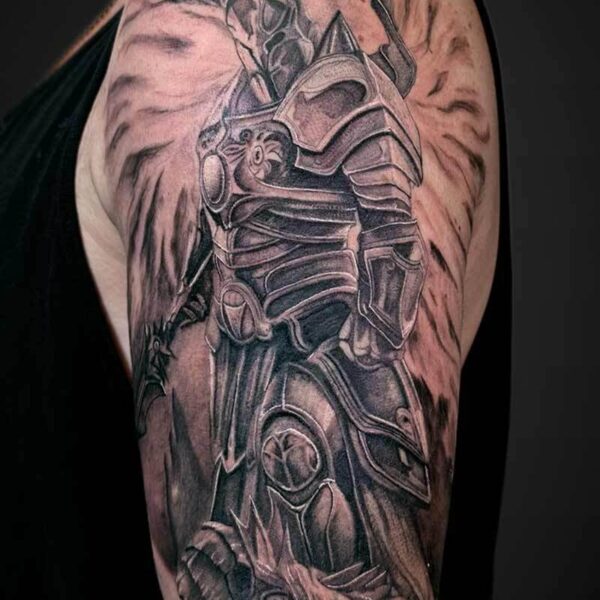 Black and Grey Realism Tattoo- Knight and Monster Atticus Tattoo| Black and grey realism tattoo of a knight standing over a slayed monster
