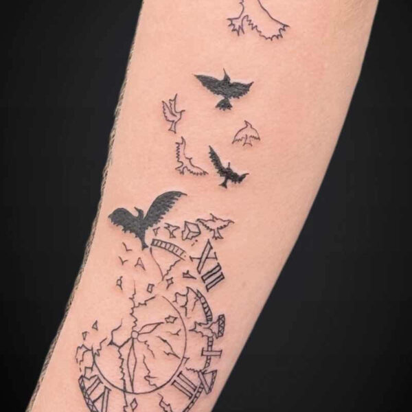 Blackwork Tattoo- Clock and Birds Atticus Tattoo| Blackwork tattoo of a broken block and birds flying out of it