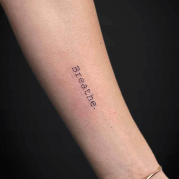 Atticus Tattoo| Fineline tattoo| Script Tattoo| Fineline tattoo of the word "Breathe"