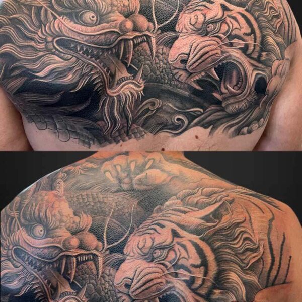 Neotraditional Tattoo- Dragon and Tiger Atticus Tattoo| Black and grey, neotraditional tattoo of a dragon and tiger fighting