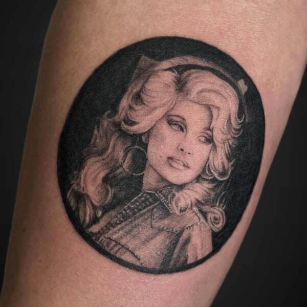 Black and Grey Realism Tattoo- Dolly Atticus Tattoo| Black and grey realism tattoo of a portrait of Dolly Parton