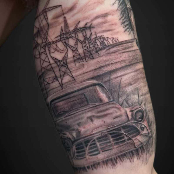 Black and Grey Realism Tattoo- Truck in a Field Atticus Tattoo| Black and grey realism tattoo of an old truck in a field and power lines in the background