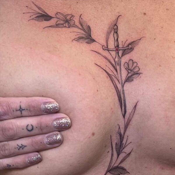 fineline-tattoo-sternum-flowers-sword fineline-tattoo-sternum-flowers-sword