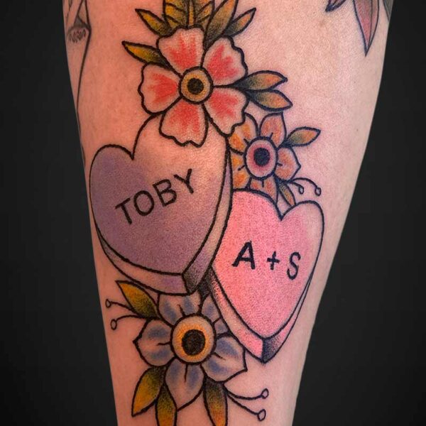 neoraditional-tattoo-candy-hearts-flowers