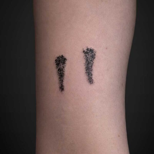 black-grey-tattoo-hedgehog-footprints