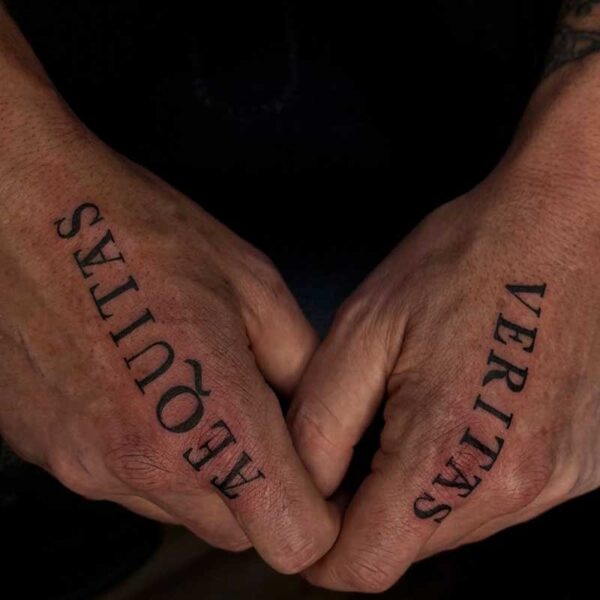 blackwork-script-tattoo