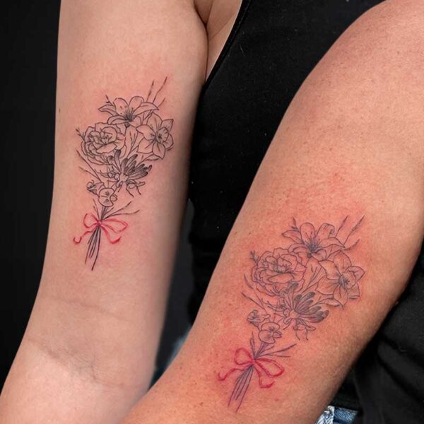 fineline-matching-tattoos-flowers-ribbons