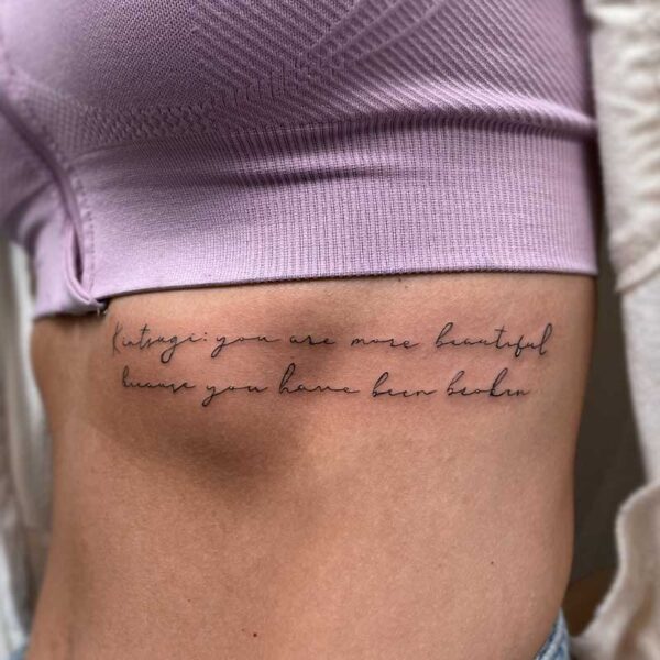 fineline-script-rib-tattoo