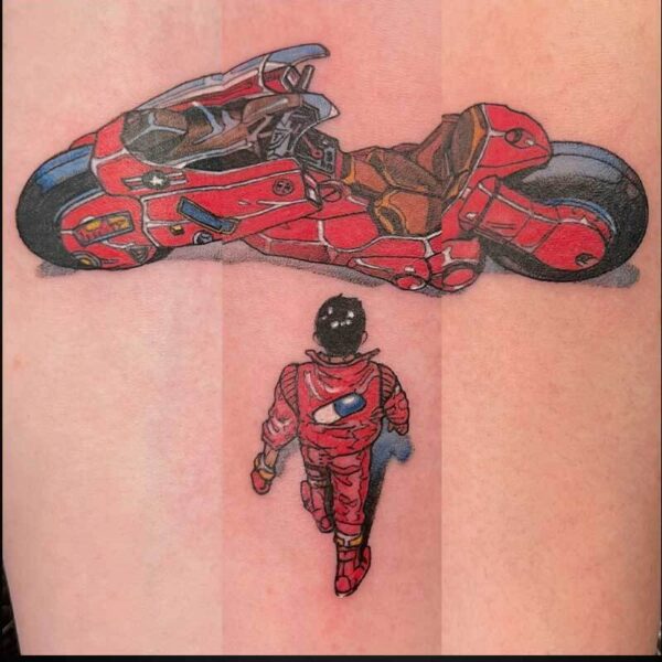 Tattoo showing a red motorcycle above a person in a red suit walking away, inked on skin.