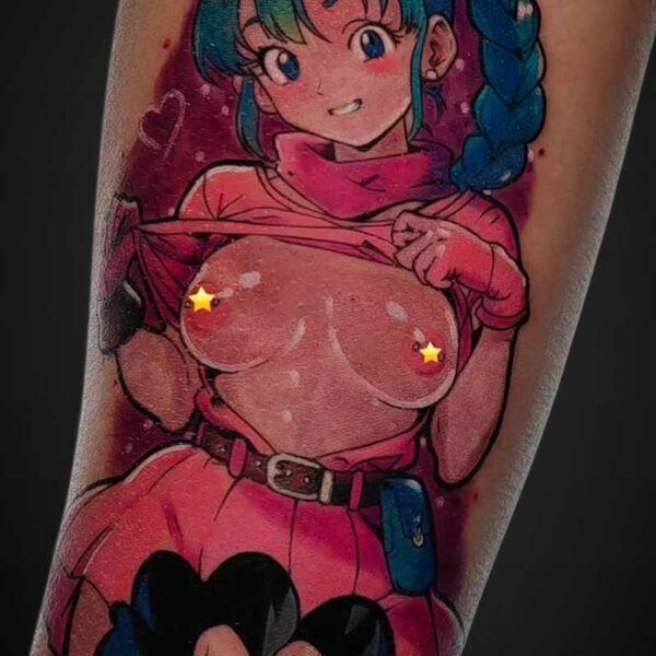 Color tattoo on the forearm showing a cartoon-style girl with turquoise hair in a pink outfit, lifting her shirt to reveal her chest, with a smaller dark-haired male fighter at the bottom.