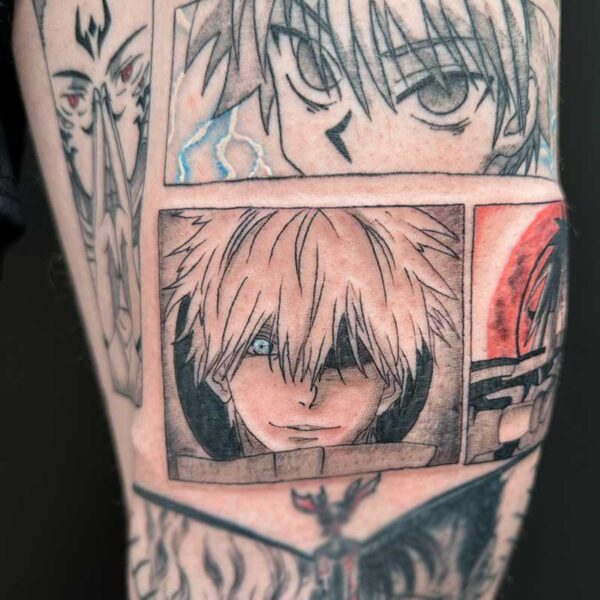 Tattoo sleeve with multiple manga panels; central panel shows a pale-haired character with a blue eye and a soft smile.