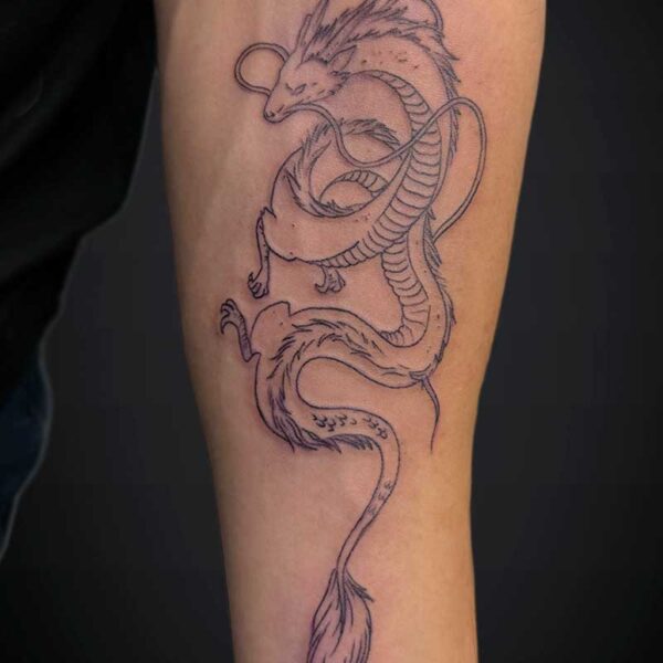 Line-drawn dragon tattoo wrapping along a forearm, with a long serpentine body and flowing fins.