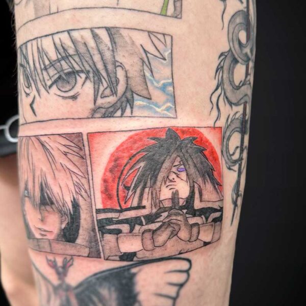 Forearm tattoo sleeve with four manga panels: close-up eyes and hair, plus a red-background portrait of a spiky-haired character making a hand gesture.