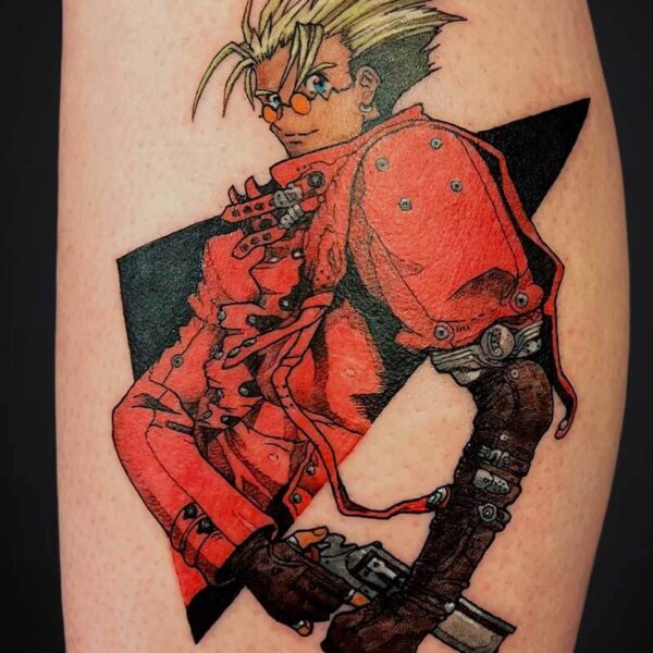 Tattoo of a spiky blond-haired anime-style character in a red coat with a large blade, angled on the leg.