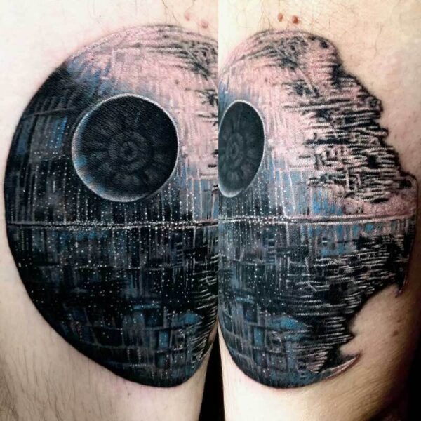 Tattoo of the Death Star from Star Wars across both buttocks, with dark shading and detailed surface texture.