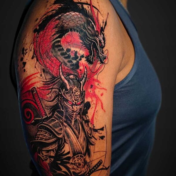 Upper-arm tattoo with a black-and-red dragon weaving around a detailed armored samurai holding a sword; bold ink and splashy red accents.
