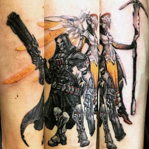Triptych tattoo design featuring armored, hooded figure with a large gun and winged warriors in black, gray, and yellow accents on the skin