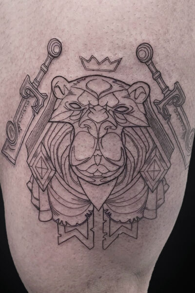 Line drawing tattoo of a regal lion with a crown, flanked by two swords on shoulders, in a geometric style on skin