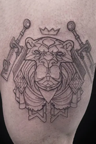Line drawing tattoo of a regal lion with a crown, flanked by two swords on shoulders, in a geometric style on skin