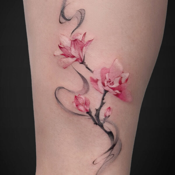 Watercolor-style pink cherry blossoms on a slender black branch along the inner forearm.