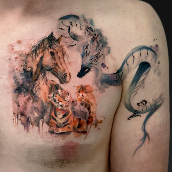 Watercolor-style chest tattoo featuring a horse, a tiger cub, a small orange cat, and scattered birds in flight, with blue-gray accents on the shoulder area.