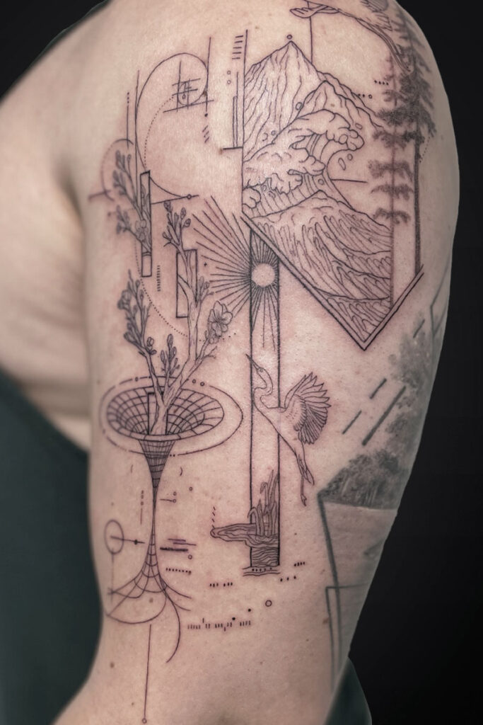 Linework tattoo on the upper arm: mountains and a crashing wave inside a diamond shape, with a sunburst, a bird, a vase with plants, and geometric connectors.