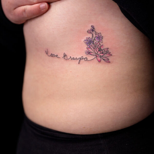 fineline-tattoo-script-lotus-orchids