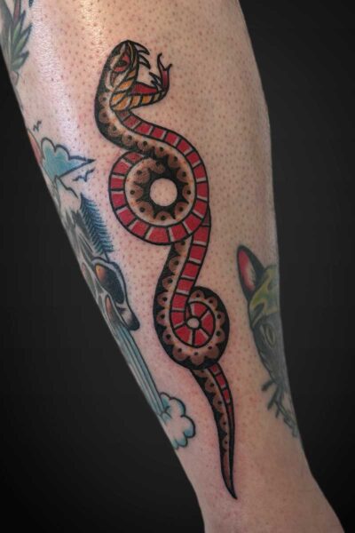 American traditional snake tattoo by Yerek at Atticus Tattoo, Calgary