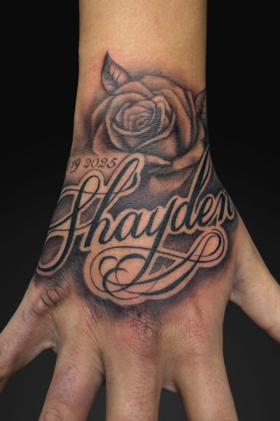 Script tattoo by Ricky at Atticus Tattoo, Calgary